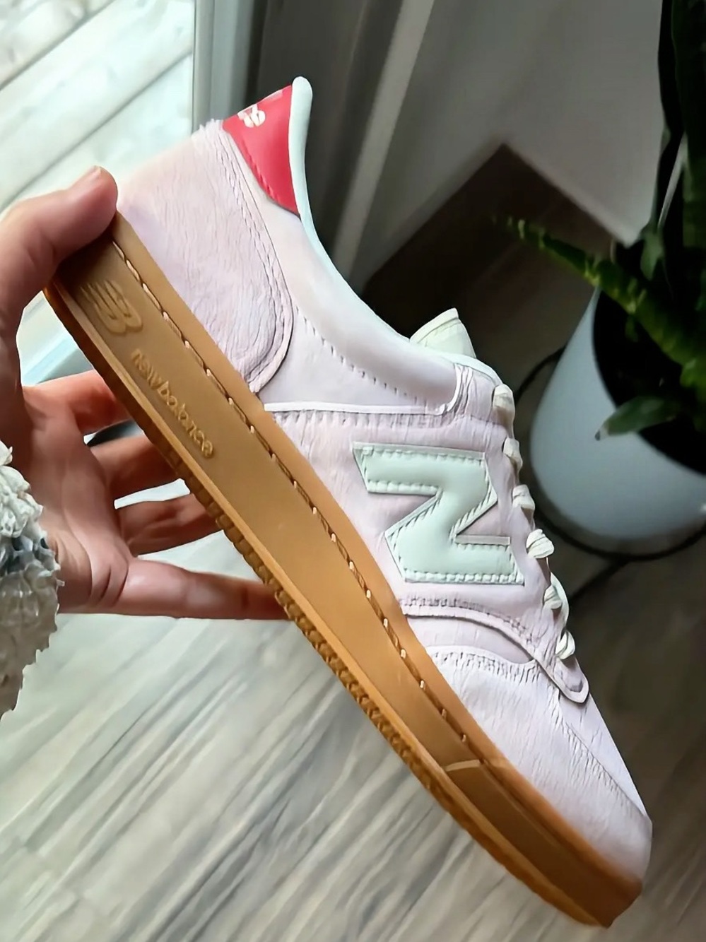 New Balance men’s Pastel Pink Leather Sneaker with Gum Outsole